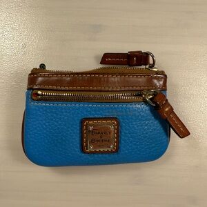 Dooney and Bourke bright blue coin purse. Leather, zipper and zipper pull great